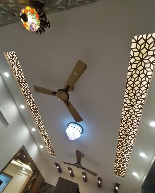 Decorative ceiling with warm geometric light panels